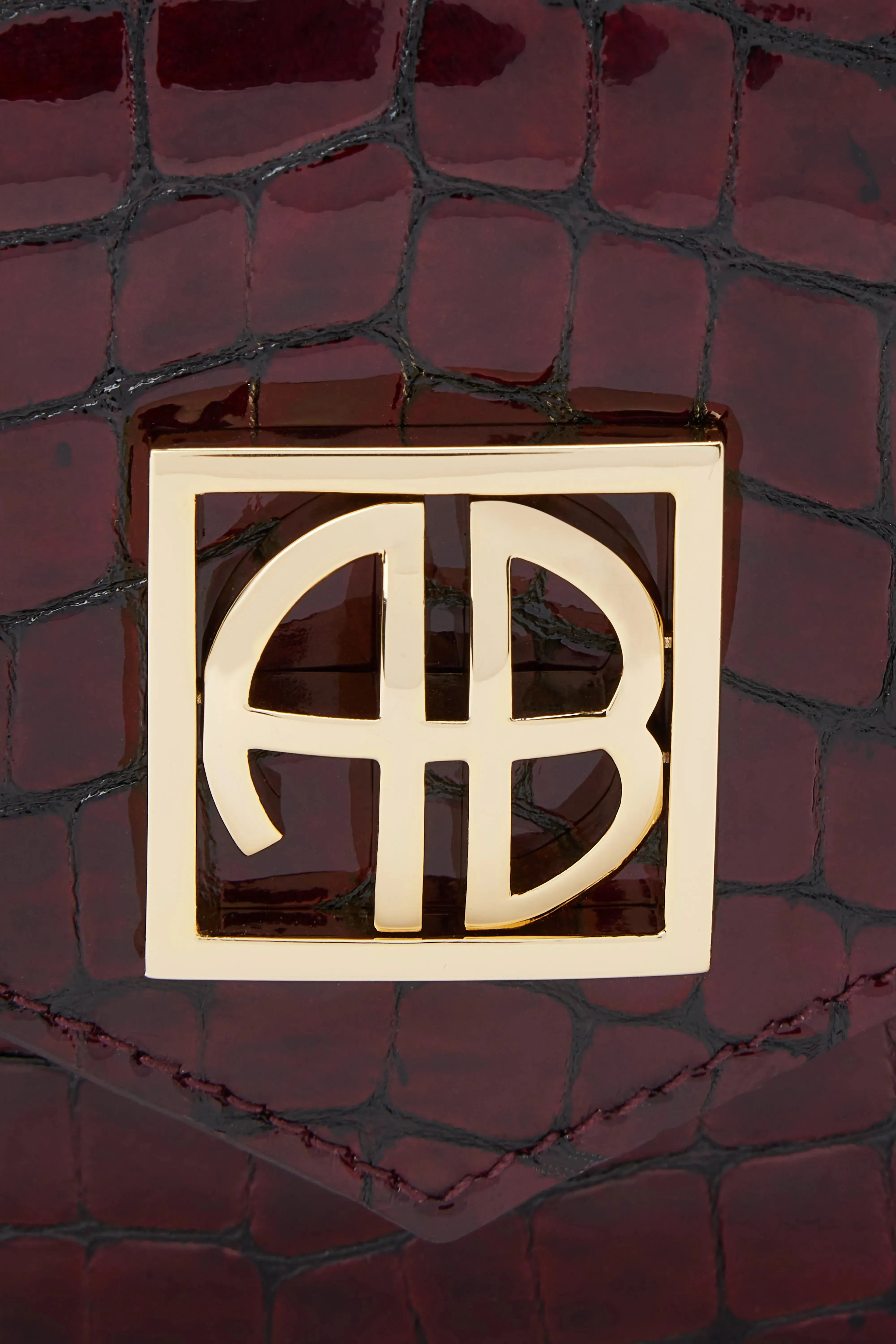 Elly Logo Embossed Mini Clutch Bag in Burgundy